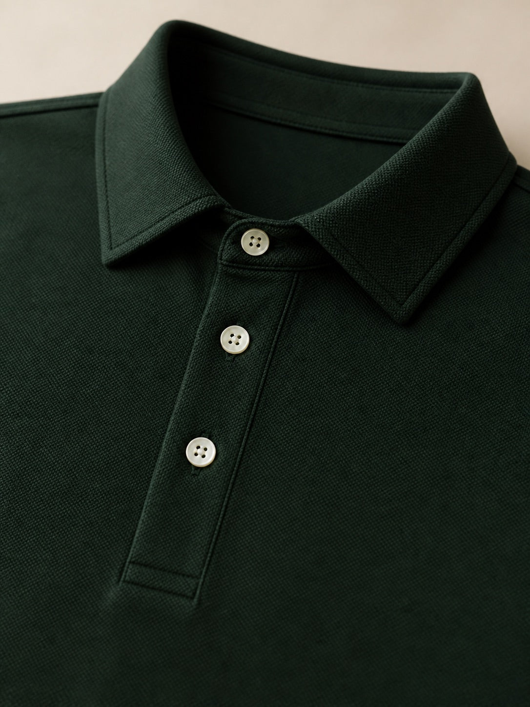 Close-up of the Aarsag long-sleeve polo collar and placket